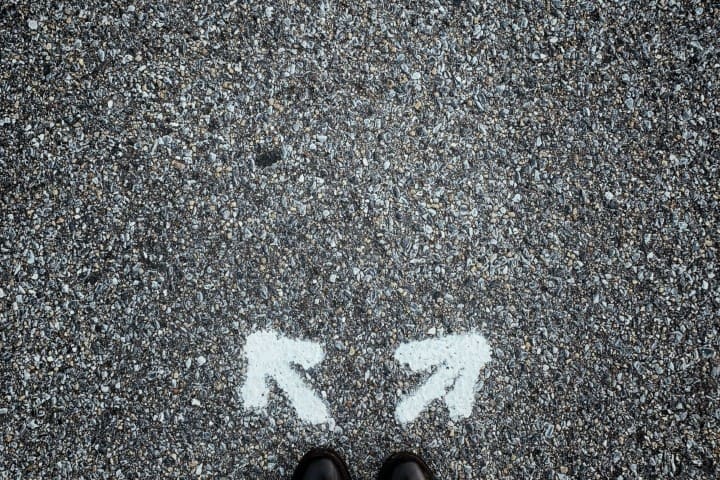 Two arrows on ground pointing different directions
